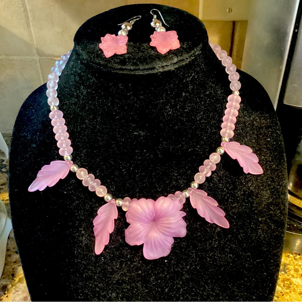 A  vintage plastic beaded pink and white floral necklace and earrings to match.